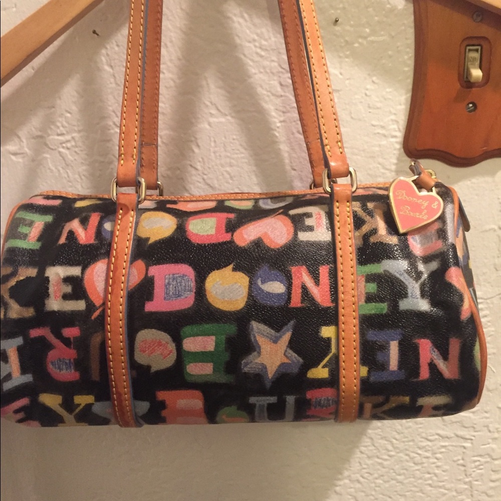 Gently used Dooney & Bourke Barrel Bag Graffiti